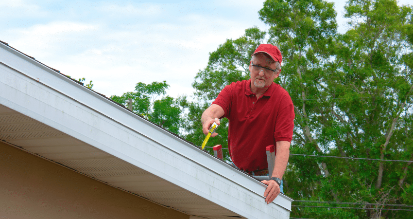 Professional inspecting shingles